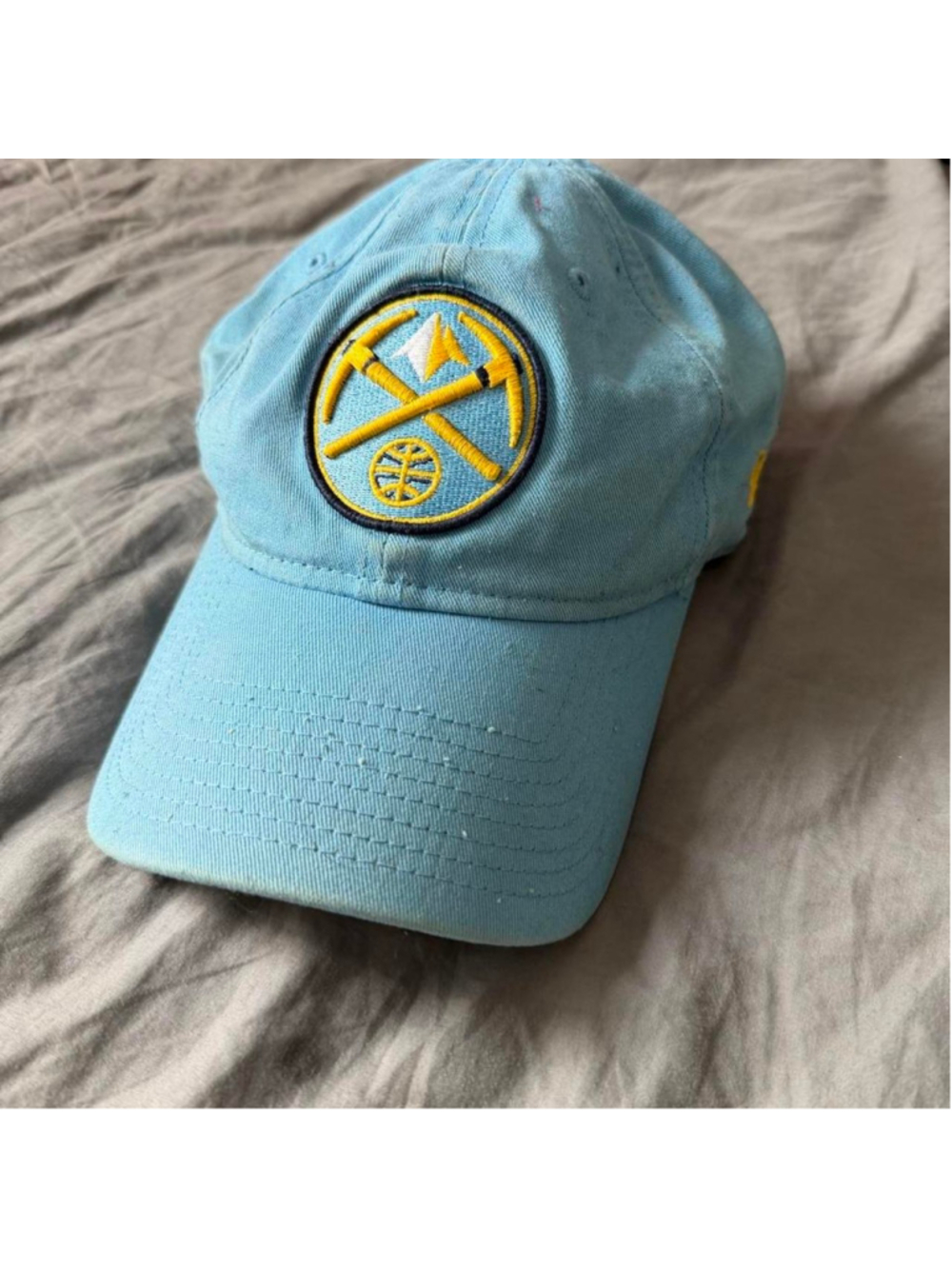 NBA Denver Nuggets blue baseball cap with yellow logo featuring crossed pickaxes